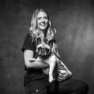 woman with french bulldog in black and white photo